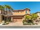 Charming two-story home with well-maintained landscaping, a brick driveway, and a two car garage at 1013 Baronet Dr, Las Vegas, NV 89138