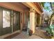 Inviting front porch with decorative door, plants, stone flooring, and a 'welcome' sign at 1013 Baronet Dr, Las Vegas, NV 89138
