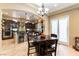 Modern kitchen with stainless steel appliances, dark wood cabinets and an island with barstool seating at 1013 Baronet Dr, Las Vegas, NV 89138