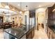 Gourmet kitchen featuring an island with seating, stainless steel appliances, and seamless access to the living area at 1013 Baronet Dr, Las Vegas, NV 89138