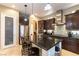 Well-equipped kitchen with a stainless steel refrigerator, granite countertops, and modern fixtures at 1013 Baronet Dr, Las Vegas, NV 89138