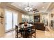 Open concept living room with built in entertainment center, fire place and tile flooring at 1013 Baronet Dr, Las Vegas, NV 89138