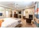 Spacious main bedroom featuring fireplace, seating area, and stylish decor at 1013 Baronet Dr, Las Vegas, NV 89138