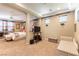 Spacious main bedroom featuring fireplace, seating area, and stylish decor at 1013 Baronet Dr, Las Vegas, NV 89138