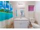 Functional bathroom with a single sink vanity and neutral-toned shower curtain at 1017 Cliffbrook Hedge Ave, North Las Vegas, NV 89081