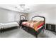 Comfortable bedroom with tile flooring, a ceiling fan, and neutral decor at 1017 Cliffbrook Hedge Ave, North Las Vegas, NV 89081