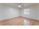 Bright bedroom featuring wood floors, ceiling fan and a window at 1017 Cliffbrook Hedge Ave, North Las Vegas, NV 89081