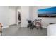 Bright bedroom featuring modern tile floors and a mounted television at 1017 Cliffbrook Hedge Ave, North Las Vegas, NV 89081