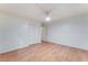 Empty bedroom with wood floors, a ceiling fan and double door closet at 1017 Cliffbrook Hedge Ave, North Las Vegas, NV 89081