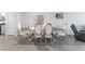 Elegant dining room features a modern table with stylish chairs and a sleek, contemporary design at 1017 Cliffbrook Hedge Ave, North Las Vegas, NV 89081
