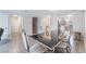 Bright dining room features a modern table, stylish chairs, and seamless transition into the kitchen at 1017 Cliffbrook Hedge Ave, North Las Vegas, NV 89081