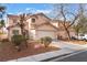 Charming home features a well-maintained front yard, desert landscaping, and an attached two-car garage at 1017 Cliffbrook Hedge Ave, North Las Vegas, NV 89081