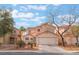 Beautiful two-story home features a well-maintained front yard, desert landscaping, and an attached two-car garage at 1017 Cliffbrook Hedge Ave, North Las Vegas, NV 89081