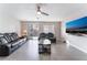 Relaxing living room features a modern television, sliding glass door, and stylish furnishings at 1017 Cliffbrook Hedge Ave, North Las Vegas, NV 89081