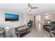 Comfortable living room features contemporary furniture, a ceiling fan, and a bright, airy atmosphere at 1017 Cliffbrook Hedge Ave, North Las Vegas, NV 89081