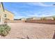 Large backyard is landscaped with gravel and surrounded by a block wall at 1021 Gary Carmena Ave, North Las Vegas, NV 89081