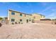 Spacious backyard with low-maintenance gravel landscaping and block wall fencing at 1021 Gary Carmena Ave, North Las Vegas, NV 89081