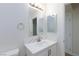 Bright bathroom with single sink vanity and light-colored finishes at 1021 Gary Carmena Ave, North Las Vegas, NV 89081