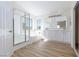 Modern bathroom with glass shower, soaking tub, and double vanity at 1021 Gary Carmena Ave, North Las Vegas, NV 89081