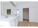 Stylish bathroom vanity with double sinks and spacious walk-in closet at 1021 Gary Carmena Ave, North Las Vegas, NV 89081