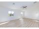 Bright bedroom with two windows and light wood flooring at 1021 Gary Carmena Ave, North Las Vegas, NV 89081