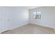 Neutral bedroom with natural light and plank flooring at 1021 Gary Carmena Ave, North Las Vegas, NV 89081