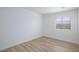 Bedroom with wood floors, white walls, and a window at 1021 Gary Carmena Ave, North Las Vegas, NV 89081