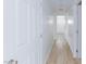 Hallway featuring doors and light wood flooring at 1021 Gary Carmena Ave, North Las Vegas, NV 89081