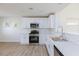 Bright kitchen with stainless steel appliances, white cabinets, and white countertop at 1021 Gary Carmena Ave, North Las Vegas, NV 89081