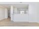 Open-concept living room with a kitchen view and natural light at 1021 Gary Carmena Ave, North Las Vegas, NV 89081
