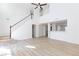 Bright living room with tall ceilings, a staircase, and light wood flooring at 1021 Gary Carmena Ave, North Las Vegas, NV 89081
