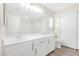 Bright bathroom with a double sink vanity and large mirror at 10510 Mojave Ridge Ct, Las Vegas, NV 89183