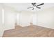A light and airy bedroom featuring wood-look floors and multiple doors at 10510 Mojave Ridge Ct, Las Vegas, NV 89183