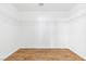 Empty walk-in closet with wood-look floors and white shelving at 10510 Mojave Ridge Ct, Las Vegas, NV 89183