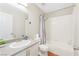 Bathroom featuring a shower and bathtub, a toilet, and sink with granite countertop at 124 Beach Oak Ave, Henderson, NV 89002
