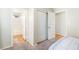 Bedroom featuring a closet, a full bathroom, carpeted floors and neutral colored walls at 124 Beach Oak Ave, Henderson, NV 89002
