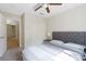 Bedroom with carpeted floors, ceiling fan, and a window with curtains at 124 Beach Oak Ave, Henderson, NV 89002