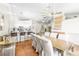 Open concept dining room with modern lighting, views of the kitchen, and seating for the bar at 124 Beach Oak Ave, Henderson, NV 89002
