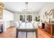 Bright dining room featuring a fireplace, modern light fixture, and sliding door access to the backyard at 124 Beach Oak Ave, Henderson, NV 89002