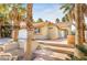 Single story home with a two-car garage and desert landscaping at 124 Beach Oak Ave, Henderson, NV 89002