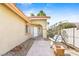 Inviting front entrance with a porch swing and desert landscaping at 124 Beach Oak Ave, Henderson, NV 89002