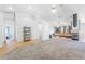 Bright and open living room featuring neutral paint, fireplace, and tile and carpet flooring at 124 Beach Oak Ave, Henderson, NV 89002