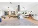 Bright, open-concept living and dining area with modern lighting and neutral decor at 124 Beach Oak Ave, Henderson, NV 89002