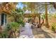 Beautiful outdoor space featuring a covered patio area with barbecue and outdoor dining at 124 Beach Oak Ave, Henderson, NV 89002