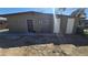 Rear of the house showing multiple access doors and utility connections at 1309 Exley Ave, Las Vegas, NV 89104
