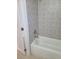Stylish bathroom showcasing a new tub with patterned gray tile surround, perfect for relaxation at 1309 Exley Ave, Las Vegas, NV 89104