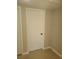 Neutral bedroom with a white door, offering a minimalist and cozy space at 1309 Exley Ave, Las Vegas, NV 89104
