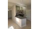 Modern kitchen with a peninsula island, gray cabinets, and stainless steel appliances at 1309 Exley Ave, Las Vegas, NV 89104