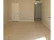Bright living room with tile flooring and white doors, perfect for modern living at 1309 Exley Ave, Las Vegas, NV 89104