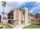 Charming condo featuring a private deck, desert landscaping, and stair access on a sunny day at 1312 Georgia Ave # D, Boulder City, NV 89005
